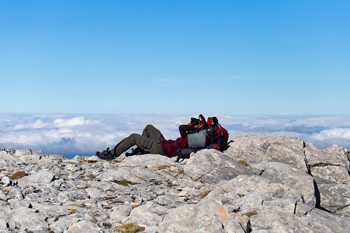 mountaineer taking a break on the rocks