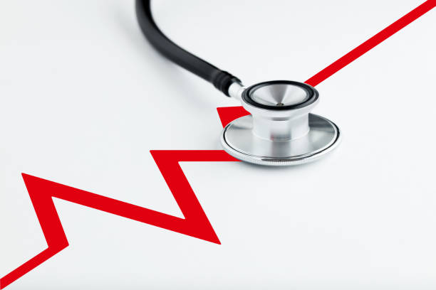 istock Medical stethoscope on white background with electrocardiogram ecg line. 1294901722