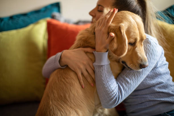 istock Young woman enjoying with her dog 1294903365