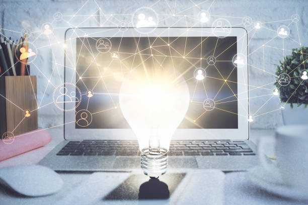 istock Computer on desktop with social network hologram. Double exposure. Concept of international people connections. 1294906966