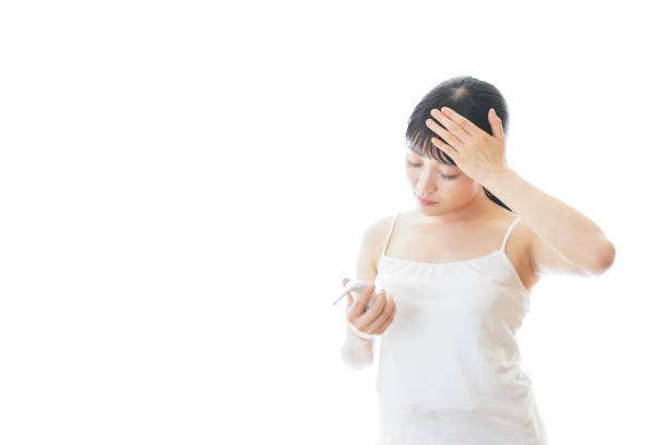 istock Young woman checking body temperature 1294907713