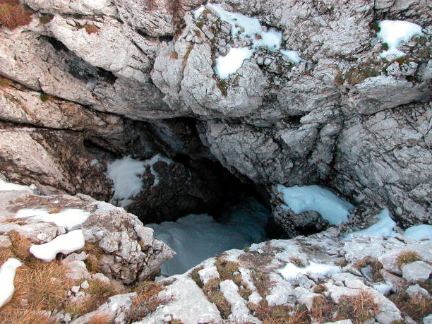 istock sinkhole with snow patches in the alps 1294907754