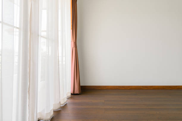 istock The empty room has wooden floors and curtains- 1294911120