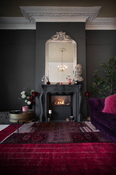 istock Living room with dark walls and authentic fireplace 1294912647