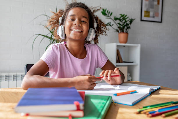 istock Young girl studying and doing homework at home 1294912703