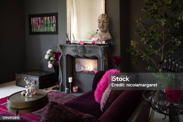 Living Room With Dark Walls And Authentic Fireplace Stock Photo - Download Image Now