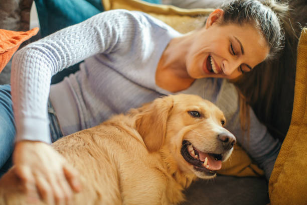 istock Young woman enjoying with her dog 1294913351