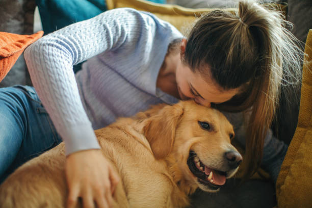 istock Young woman enjoying with her dog 1294913360