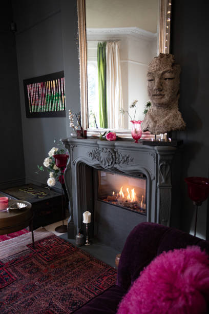 istock Living room with dark walls and authentic fireplace 1294913364