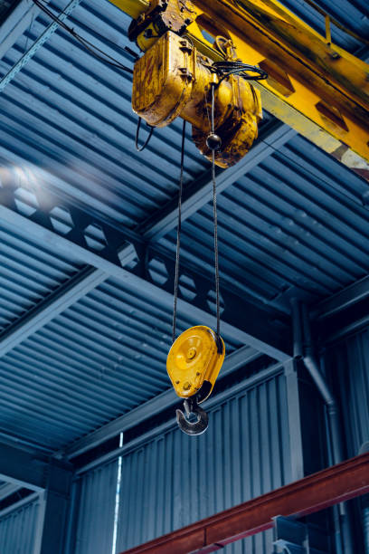 istock Industrial crane hook in a modern factory building 1294915327