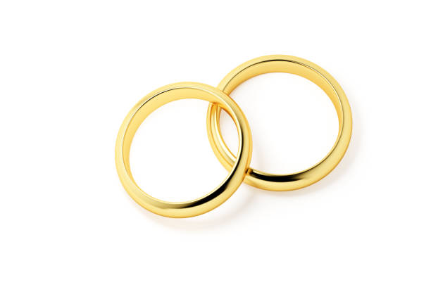 Two golden wedding rings isolated on a white background.