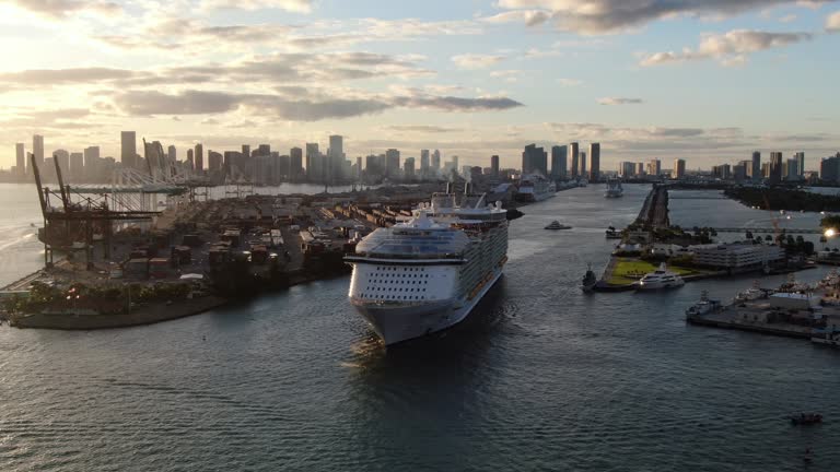 Huge cruise ship leaving Port of Miami at sunset, USA