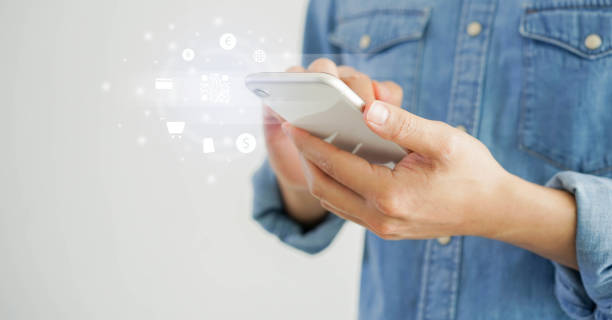 istock close up man hand holding smartphone to access on banking application to using scanning QR code yo make payment on worldwide marketplace website shopping for cashless and contactless concept 1294918424