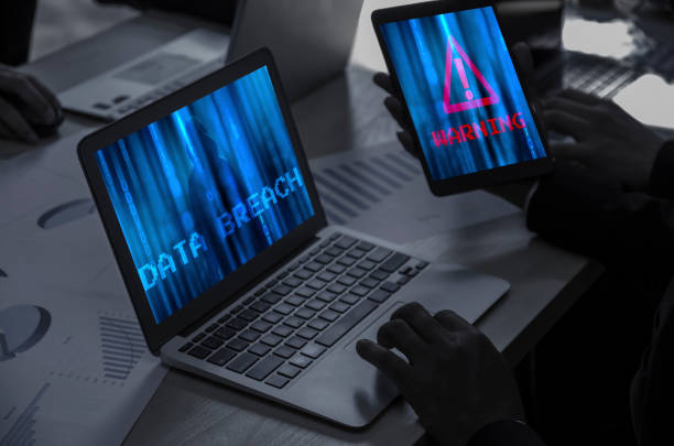 istock GDPR and cybersecurity internet. Protection of private personal data. Person using internet on laptop and warning in mobile with hack password and money from bank account. Two Factor Authentication 1294921266