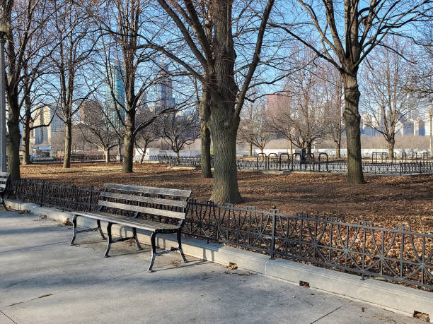 istock empty bench in Chicago city park 1294922902