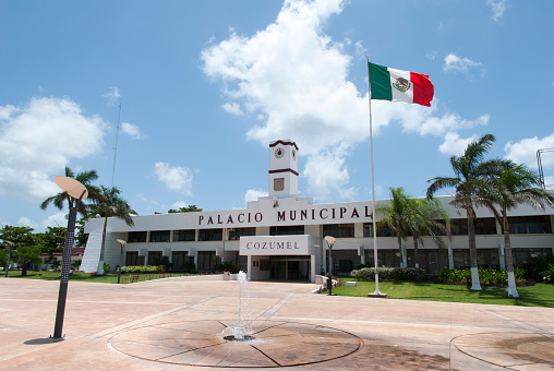 The modern San Miguel town hall with a clock tower on Cozumel island (Mexico).