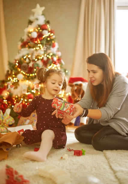 istock Mother showing gift to her daughter 1294926870
