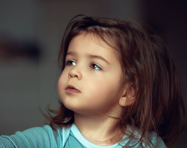 istock Cute baby girl looking up 1294927876