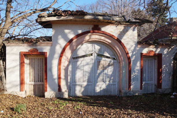 old white stone dilapidated gate in a bulgarian village.