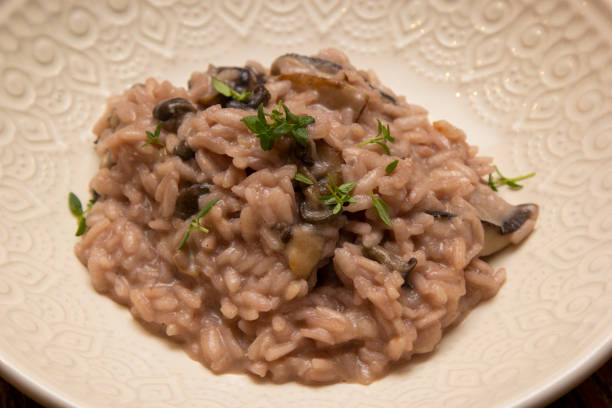 istock Mushroom risotto, on the wooden table. 1294930348