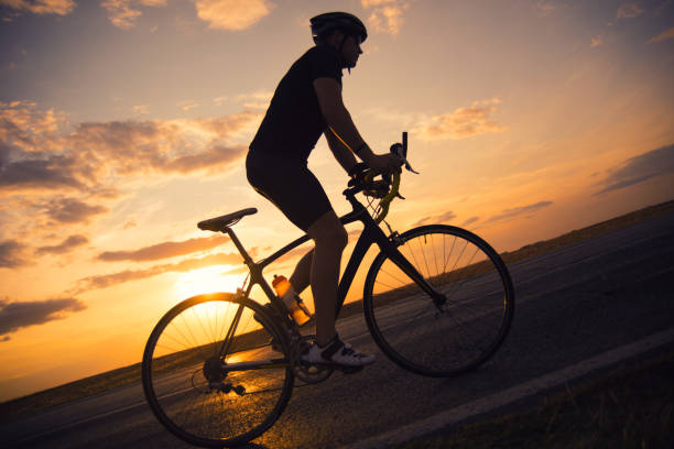 istock Young man cycling on the road 1294931543