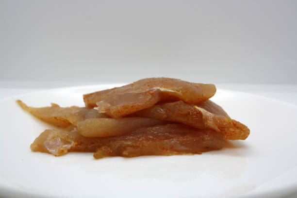 istock Chicken fillet pieces on a white plate. 1294936321