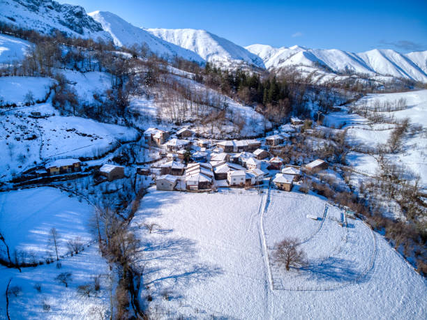 The town of Ligueria with snow in Piloña, Spain stock photo