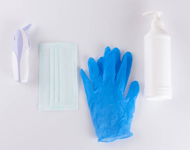 istock covid 19, digital, mask, gloves and disinfectant on white background 1294941088
