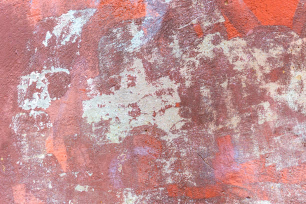 istock Plastered wall with a dirty red brown 1294941415
