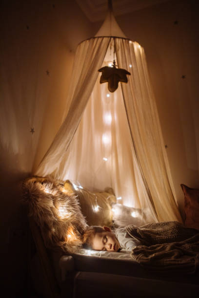 istock Little preschool girl sleeping in comfortable bed 1294942303