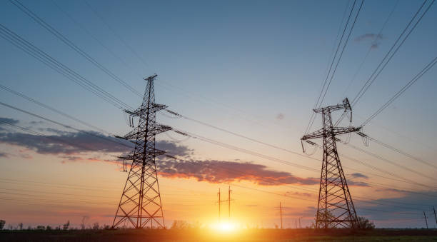 istock Electrical substation silhouette on the dramatic sunset background 1294943146