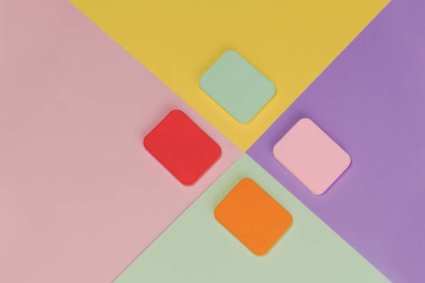 istock Top view of multi-colored sponges on different pastel-colored backgrounds. Abstract image 1294943259