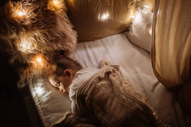 istock Little preschool girl sleeping in comfortable bed 1294943568
