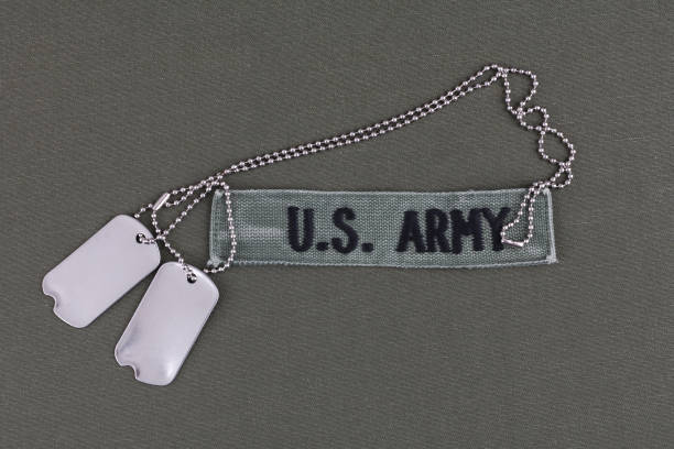 istock U.S. Army Branch Tape with dog tags on olive drab uniform 1294943594