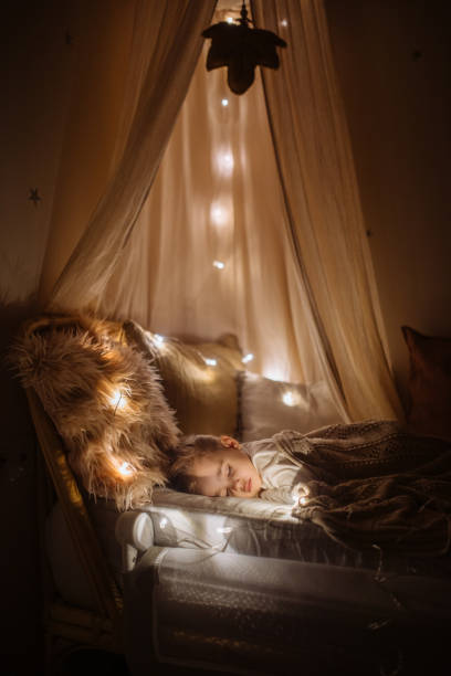 istock Little preschool girl sleeping in comfortable bed 1294944210