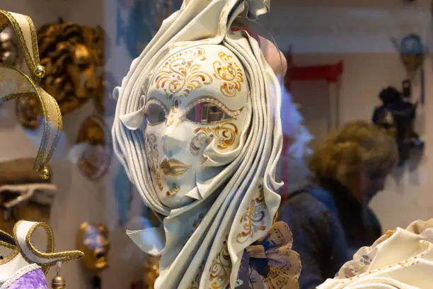 Photo of Traditional venetian mask in store on a street in Venice Italy. Venetian mask Italy. Selective focus.