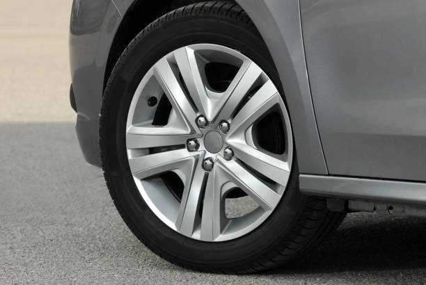 istock tire and alloy wheel on this small passenger car 1294948692