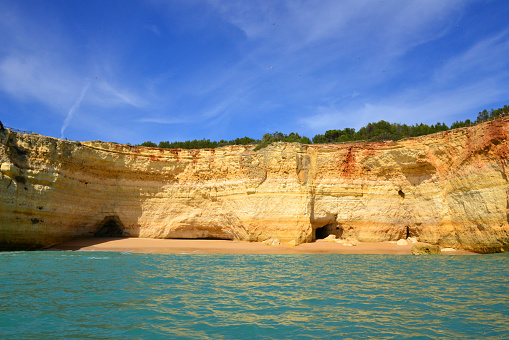 Lagoa, Algarve / Faro district, Portugal: Corredoura beach - a small cove with several caves located under golden cliffs - seen from the sea - Praia da Corredoura.