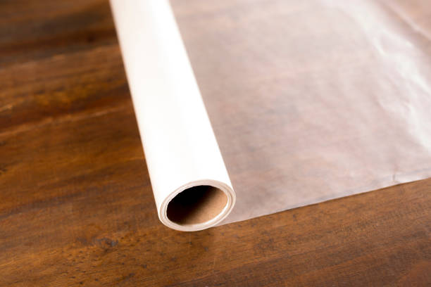 istock Rolled out Wax Paper on wooden table. 1294952352