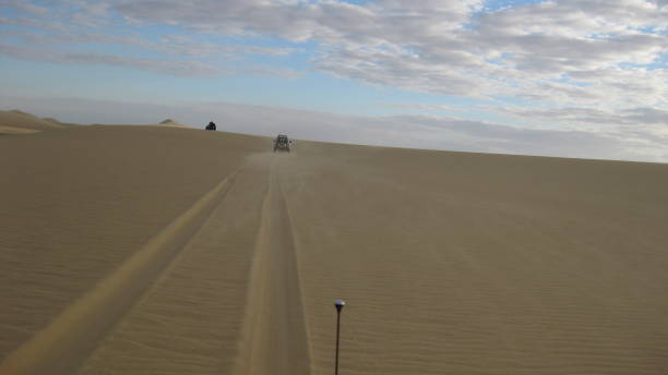 istock Car in the desert 1294956642