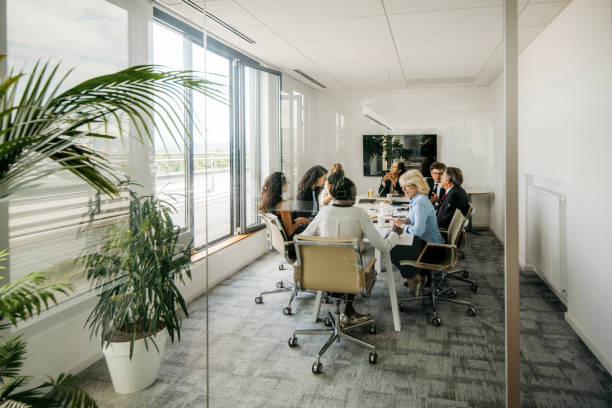 istock Executive Team Meeting Photographed Through Window 1294958625