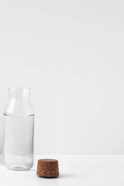 istock Transparent bottle with cork stopper on a white background. Copy space, mock up. 1294959276