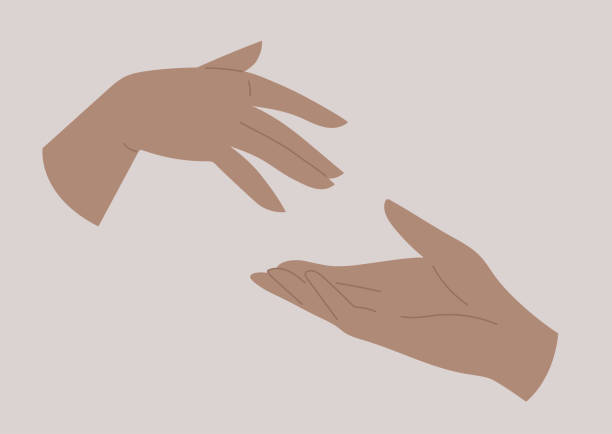 istock Two hands reaching out to each other, human relationships, love and friendship 1294959888