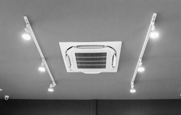 istock Modern ceiling mounted cassette type air conditioning system in coffee shop 1294961309