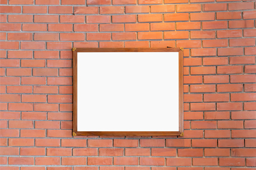 Mockup of Blank photo frames display on the brick wall in coffee shop for your design