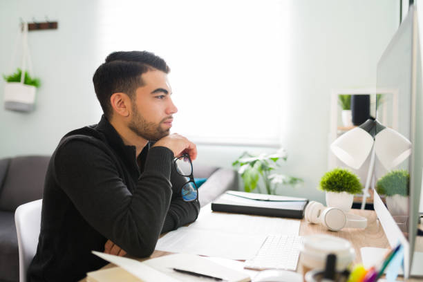 istock Side view of a young guy working as a writer and editor 1294963187