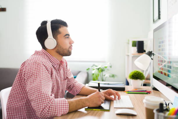 Profile of a man at the office working as a graphic designer