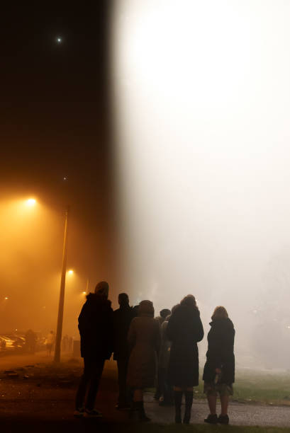 istock Group of people seeing UFO in the sky. 1294964089