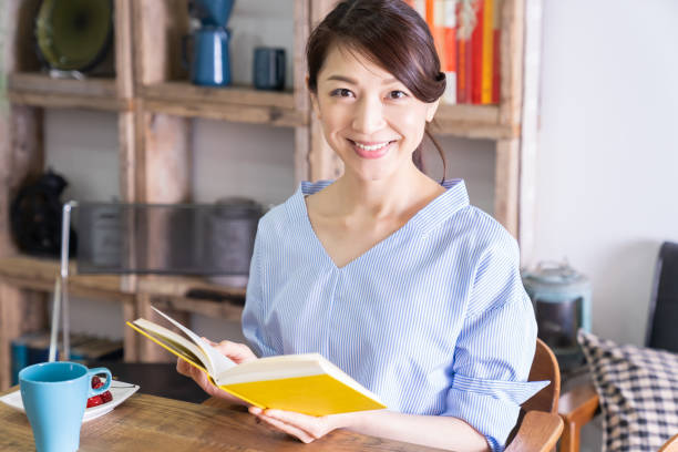istock asian woman who reads a book 1294965128