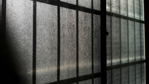 istock Patterned old glass windows, the morning sun shines in 1294971032